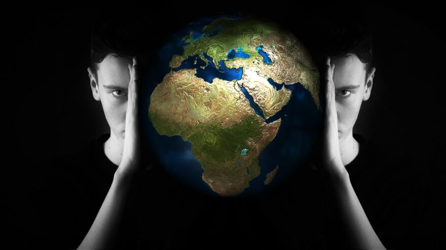 Two mirrored faces framing a glowing Earth, symbolizing global grandparenting, family connection across generations, and worldwide care