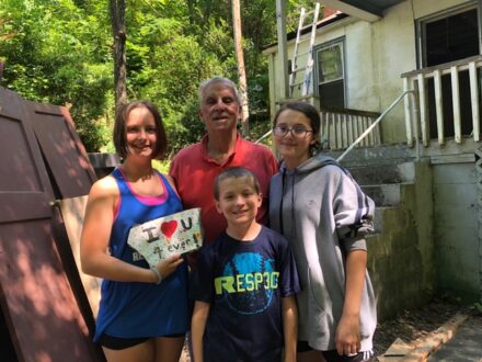 Neil Taft with his three grandkids enjoying an outdoor activity