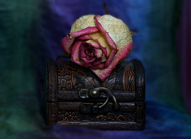 Decorative rose resting on an ornate keepsake box, symbolizing family memories, heritage, and the lasting bonds of grandparenting.