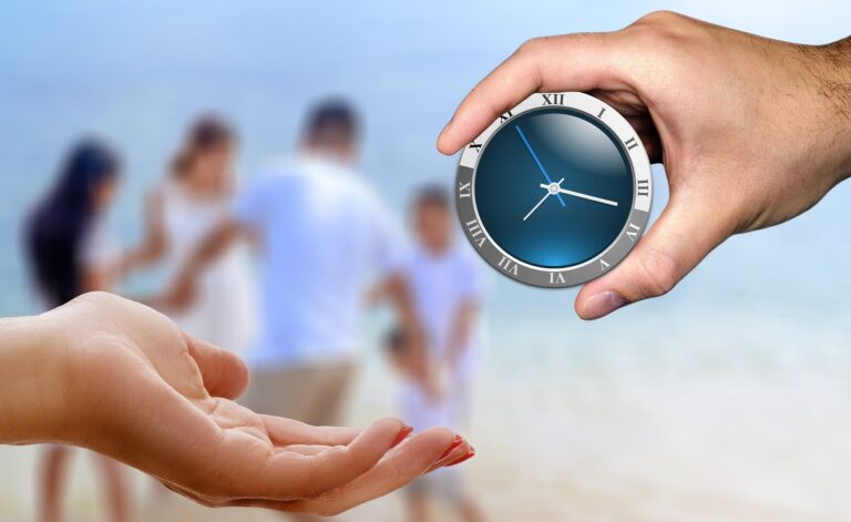 Hands holding a clock in front of a blurred family, symbolizing the importance of making time for family connection and caregiving.