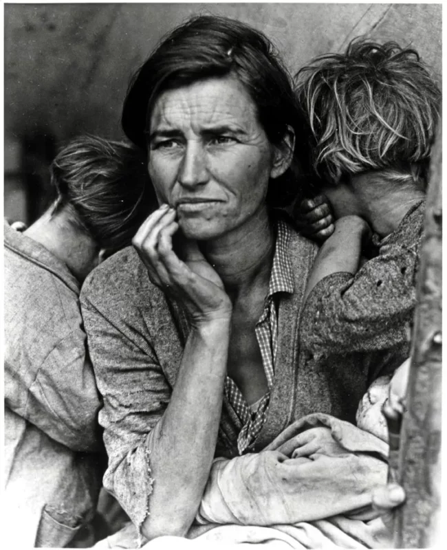 Black and white photo of a distressed mother with children leaning on her, capturing family hardship, resilience, and the protective bond between generations in grandparenting stories.protective bond between generations in grandparenting stories.