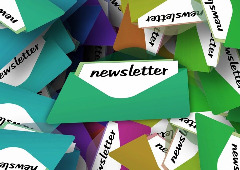 Colorful envelopes labeled newsletter stacked together, representing grandparenting news, family updates, and resources for grandparents.